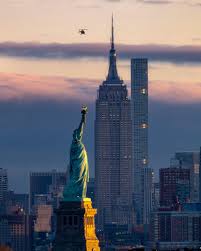 Itap Of The Sunrise Over Manhattan And The Statue Of Liberty By Colinsurprenant Photos Amazi Jesus Statue Liberty Wallpaper Statue Of Liberty Drawing