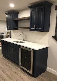 Basement Kitchen Blue Cabinets White Tile Backsplash Some Houses Have Basements And Sometimes It In 2020 Basement Kitchen Basement Kitchenette Basement Bar Designs
