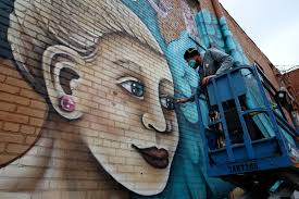 Massive mural brings new life to 1920-brick building in downtown Hutch