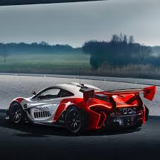 The Famous Mclaren Rocket Red And Anniversary White Are The Core Colours On This Striking Mclaren P1 Gtr By Mclaren Special Operat Mclaren P1 Gtr Ayrton Senna