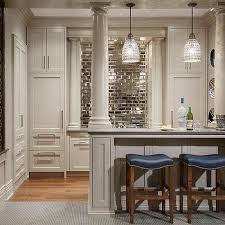 They automatically make a room look bigger, and they're relatively easy to clean. Basement Bar Mirrored Subway Tile Backsplash Design Ideas