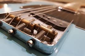 Reset the peg to hold the string in place. How To Change Your Guitar Strings In 15 Steps