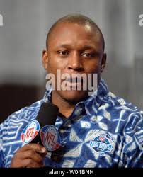 Detroit Lions running back Barry Sanders avoids a tackle from David Rocker  of the Los Angeles Rams for a four-yard run in the second quarter in  Anaheim, California