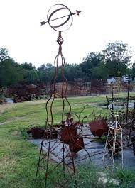 Would Look Great In A Large Garden Surrounded By Tall Colorful Flowers Yard Art Metal Plant Hangers Diy Garden Art