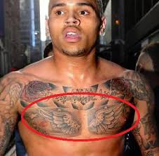 But his latest ink is drawing controversy.the image, on the singer's singer chris broiwn has a new tattoo that many think resembles his former girlfriend, rihanna, seen at left in 2012.getty images / today. Chris Brown S 26 Tattoos Their Meanings Body Art Guru