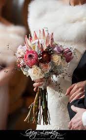 Below is a guide to south africa's popular wedding blooms and when they're in season. Elegant Wedding Bouquet Mixing South African Proteas And Multicolour Roses Winter Wedding Flowers Safari Wedding Elegant Wedding Bouquets