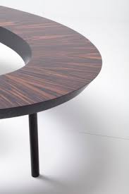 The urban port diamond shape this rectangular shaped coffee table is made of a wooden frame and tufted leather ottoman on top. Coffee Bean Table By Nada Debs For Sale At Pamono