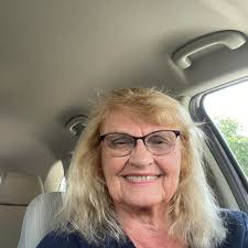 Grizzly 1063 walking with one of her cubs.