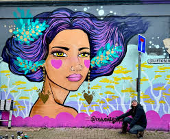 Nice new bit of artwork created by Claudia La Bianca in Clifton road  Southsea. She braved the cold and brought some warmth to the street.