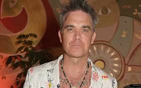 Robbie Williams' dad Pete thanks NHS staff after suffering nasty injury in  painful fall