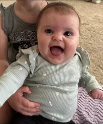 Can anyone make the baby smile in the picture of her and I or face swap  with the picture she's smiling please