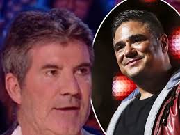 X Factor's Simon Cowell stunned as singer defies him by REFUSING to split  from his group and go solo