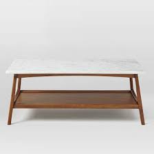 If you want your living room to stand out, then this is the coffee table for you. Reeve Mid Century Coffee Table Rectangle Marble Walnut West Elm Havenly