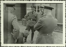Above the gate are the words 1936 1945 Sachsenhausen Concentration Camp Gedenkstatte Und Museum Sachsenhausen