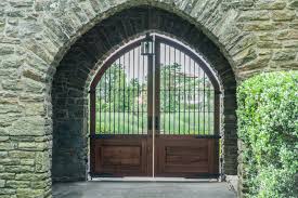 Entry gates constructed with salvaged lumber and reclaimed douglas fir, this spanish style gate features iron strapping, clavos and an iron frame. Custom Designed Driveway Gates Tri State Gate