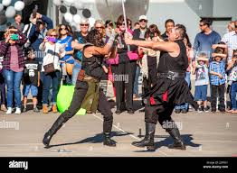 Actors Costumed As Characters From The Futuristic Science Fiction Movie Star Wars Cross Light Sabers As The Crowd Watches Outside The Futuristic Oakley Headquarters In Foothill Ranch Ca Photo By Spencer Grant