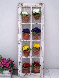 I gave the frames a fresh new dry brushed look and hung them vertically for a fun change: 20 Different Ways To Use Old Window Frames