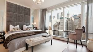 A contemporary design showcasing an upholstered headboard and high ceiling sheer curtains and slate tile floors this master bedroom is gorgeously designed. 20 Gorgeous Master Bedroom Headboard Ideas