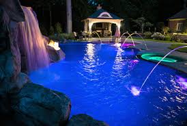 Pentair deck jet water effects can be cast into concrete decks and gunite pool walls, mounted in the sidewall of pools, or blended into landscapes. Custom Fire Water Features Long Island Tanning Ledge Swim Up Bar