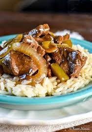 Beef Tips And Rice With Sauteed Onions And Peppers Covered In A Savory Gravy Made In A Dutch Oven Or Crockpo Beef Tips And Rice Beef Tips And Gravy Beef Tips
