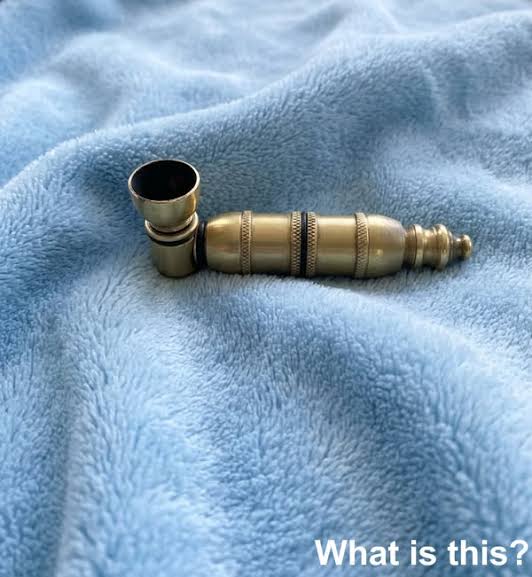 Discovered in the dusty drawer of my grandfather, an avid collector. A tiny  brass object, aged yet noble, with intricate details. What could it be? See  the f!rst comment for the answer.