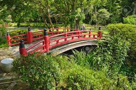 We have a bridge we have constructed, it is unpainted. Beautiful Japanese Garden With A Lake And A Red Bridge In The Stock Photo Picture And Royalty Free Image Image 12436798