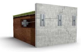 Wall plate anchors secure basement and retaining walls that are bowing, leaning or cracking due to too much outside soil pressure. Davenport Leaning Retaining Walls Midamerica Basement Systems