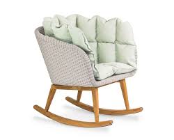 While we'll never take a dig at the traditional rocker grandma settled into every evening, today's outdoor rocking chairs come in designs worth raising a glass of sweet tea for. Shell Rocking Chair Teak Shell Collection Fueradentro Outdoor Design Furniture