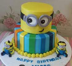Place 3/4 of the container of whipped frosting into a bowl and stir in yellow food coloring. Minion 2 Tier Cake 3