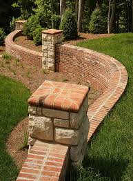 Brick Walls Are Both Beautiful And Durable This Serpentine Wall Features Special Shape Brick Coping And Rowlock Copi Brick Wall Brick Fence Brick Wall Gardens