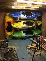 This Beautiful Diy Kayak Rack Complete With A Very Nice Collection Of Boats Belongs To Paul Preston Kayak Rack Kayak Boats Kayaking