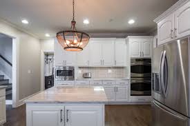 Off White Kitchen With Granite Countertops Brushed Nickel Pulls By Atlas Hardware Kitchen Design Small Modern Kitchens Best Kitchen Cabinets