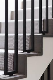 Staircase With Iron Spindles And Gray Herringbone Runner Contemporary Entrance Foyer Stairs In Living Room Stairs Design Staircase Design