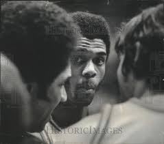 1976 Press Photo James "Stretch" Gregory listens to Wisconsin Coach Bill  Cofield