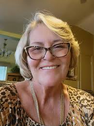 What hairstyle would be suitable for a woman over 50 with curly hair?