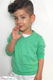 The slightly longer hair on the top of the head shows off the movement and body of this naturally curly hair, while the shorter sides give it a clean and sleek look that is undeniably trendy and modern. Little Boy Haircuts With Curly Hair Haircuts For Toddlers With Curly Hair