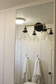 These are wall mounted bathroom light fixtures that you will likely find on either side of your bathroom mirror. How To Mount A Light On Top Of A Mirror Bathroom Vanity
