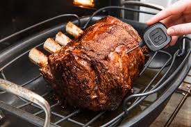After 15 to 30 minutes, place vegetables on rack around roast; Best Prime Rib Recipe How To Cook Prime Rib
