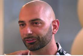 Why did John change his last name to Fuda?