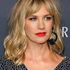 At the 2014 hollywood foreign press association's annual grants banquet, she showed up with her long blonde hair flat on her head, tucked behind her ears, roots showing. 1