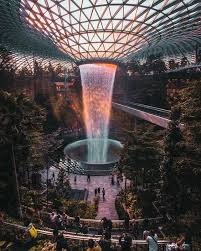 The Rain Vortex At Jewel Changi Airport The Most Colourful Photography Locations In Singapore Singap Singapore Garden Singapore Travel Cool Places To Visit