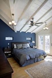 Black And Blue Bedroom Black Bed Frame With Headboard Navy Blue Walls White Ceilings Light Hardwood Floors Light Toned Area Rug Dar Blue Bedroom Walls Dark Blue Bedrooms Blue Bedroom