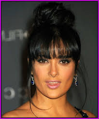 Start by putting the hair in a high ponytail, leaving out the fringe and a small section on the side for a braid. High Bun W Bangs Bun Hairstyles Hair Styles Black Hair Bun