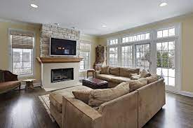 Tv On Stone Above Gas Fireplace Large Open Windows And Recessed Lighting Light Tan Couches Ag Family Room Design Direct Vent Fireplace Family Room Addition