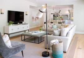 Combining a classic mix of synthetic leather rustic engineered wood and durable metal this industrial style square coffee table graciously adorns just about any living. Light Gray Sectional With Gray Leather Ottoman Coffee Table Transitional Living Room