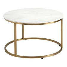 A transparent tempered glass tabletop allows light to flow effortlessly through this small table design. Round White Marble Milan Coffee Table World Market