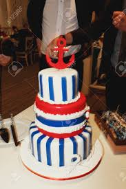 You can earn black feel homier with the addition of wood tones, like a mahogany colored floor. Tasty Wedding Cake Decorated With Blue Stripes With A Red Anchor On The Top Stock Photo Picture And Royalty Free Image Image 71097695