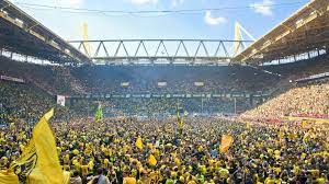 Westfalenstadion has a capacity of over 80,000, and the yellow wall is an especially iconic part of the stadium, as the fans in that section can be an intimidating presence to the opposition. Football Trips Borussia Dortmund