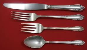 The place settings in a traditional collections include dinner forks, salad forks, soup spoons, tea spoons, and dinner knives. Dancing Flowers By Reed And Barton Antique Silver Patterns
