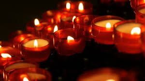 Row Of Christian Prayer Red Round Votive Candles Burn In The Dark Prayer Lighting Sacrificial Candles Close Up Burning Memorial Candles In Catholic Church Celebrating Christmas In Cathedral Stock Video C